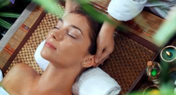 Person receiving a massage therapy session to improve sleep quality.