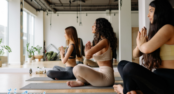 Group of people practicing yoga in Oviedo at Sacred Moments Massage & Healing Center.