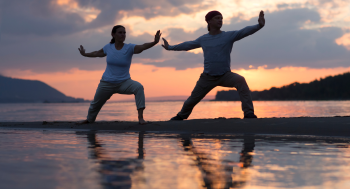 Group of people practicing Tai Chi at Sacred Moments Massage & Healing Center.
