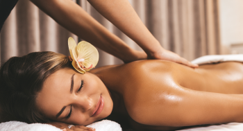 Person receiving a massage therapy session in Oviedo