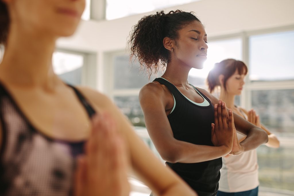 Women taking a yoga class.