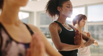 Women taking a yoga class.