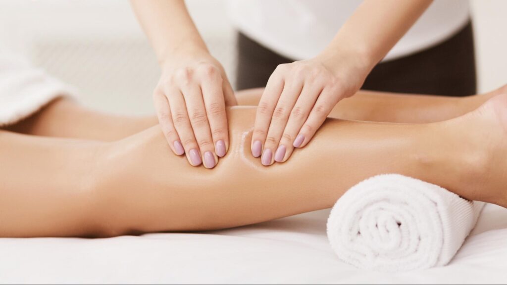 A woman having sports massage therapy.