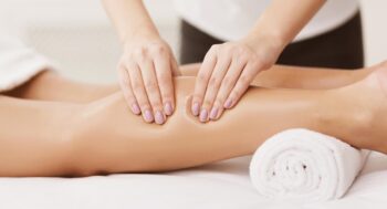 A woman having sports massage therapy.